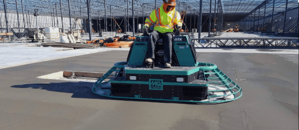 Whiteman ride-on concrete trowel on a construction site